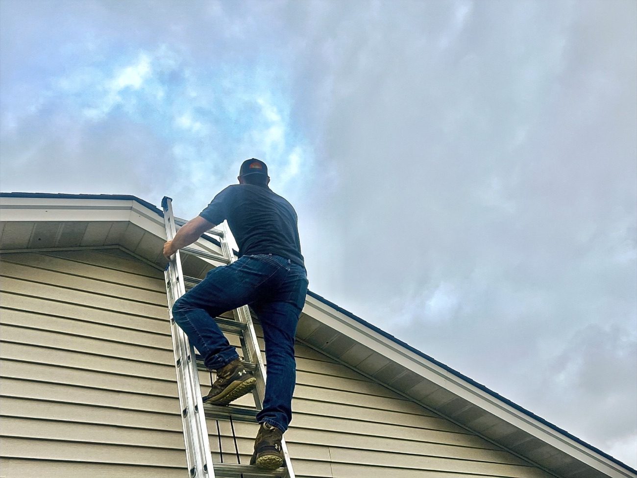 AllGood Home Improvements crew member working on gutters at a Greater Cincinnati home